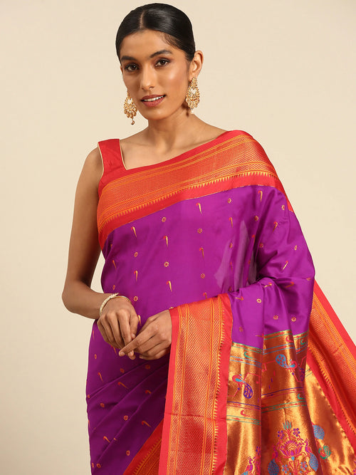 Muniya paithani saree soft silk in purple red with muniya and flower meena butti - closeup view showing fabric and zari work for wedding wear