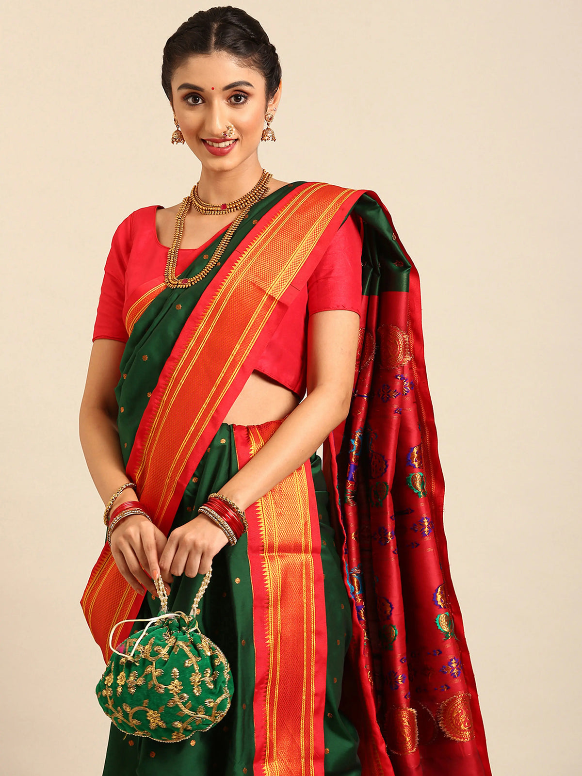 Closeup of Maharani Nauvari Paithani saree soft silk 9 yard Kashta saree in bottle green and red with Paithani design details