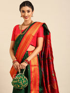 Closeup of Maharani Nauvari Paithani saree silk blend 9 yard Kashta saree in bottle green and red with Paithani design details