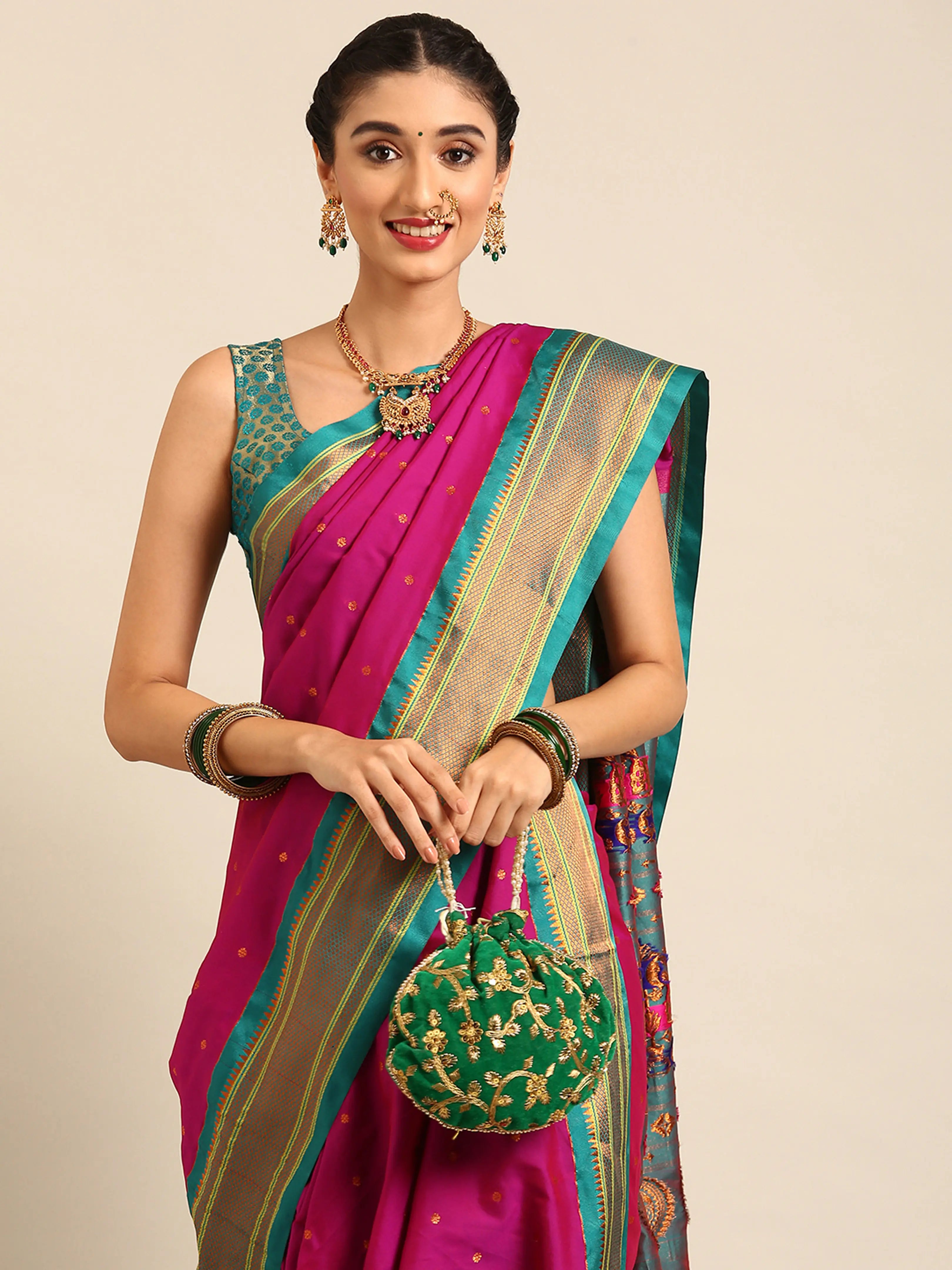 Closeup of Maharani Nauvari Paithani saree silk blend 9 yard Kashta saree in magenta and rama with Paithani design details