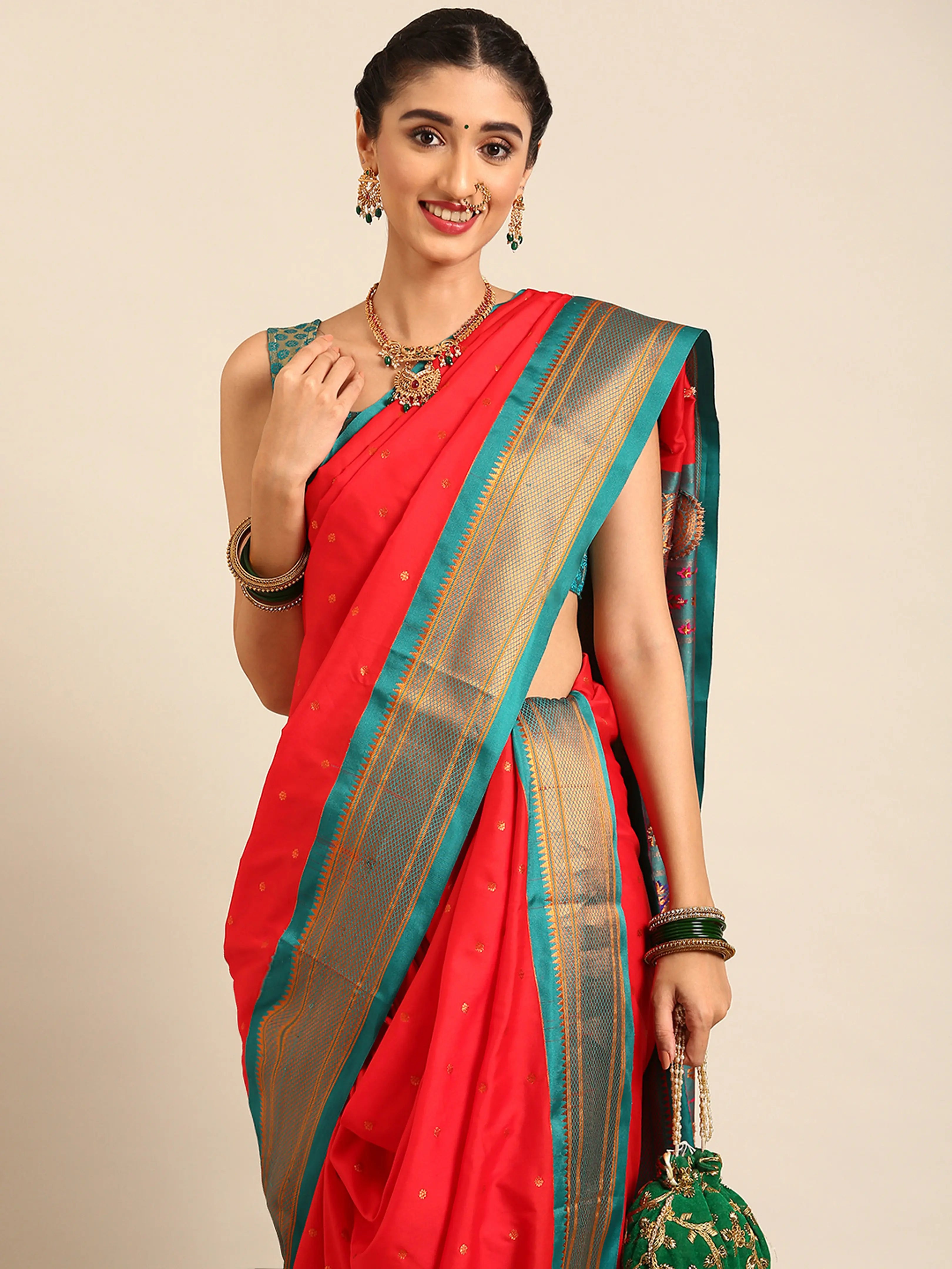 Closeup of Maharani Nauvari Paithani saree silk blend 9 yard Kashta saree in red and rama with Paithani design details