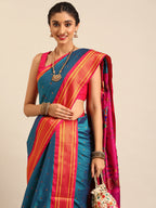 Closeup of Maharani Nauvari Paithani saree silk blend 9 yard Kashta saree in teal blue and pink with Paithani design details