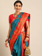 Closeup of Maharani Nauvari Paithani saree silk blend 9 yard Kashta saree in teal blue and red with Paithani design details