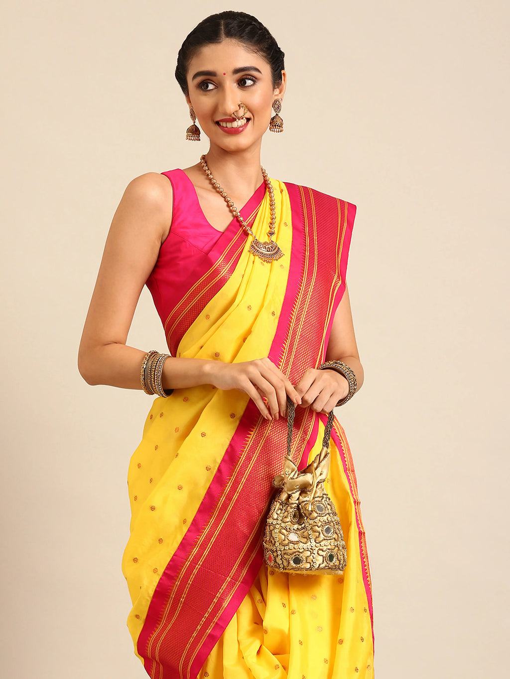 Closeup of Maharani Nauvari Paithani saree silk blend 9 yard Kashta saree in yellow and pink with Paithani design details