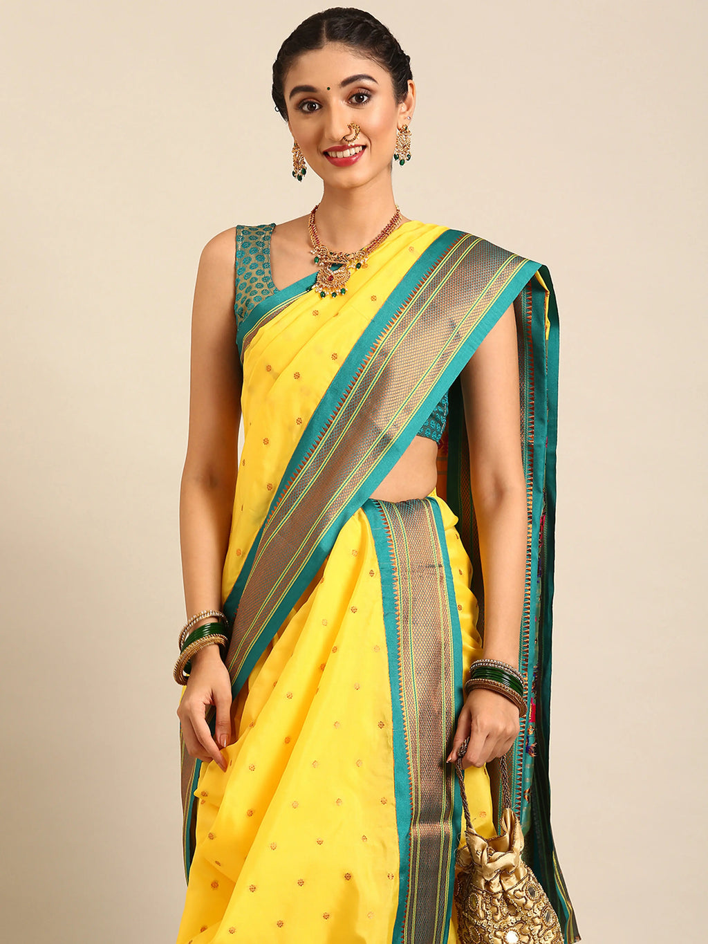 Closeup of Maharani Nauvari Paithani saree silk blend 9 yard Kashta saree in yellow and rama with Paithani design details