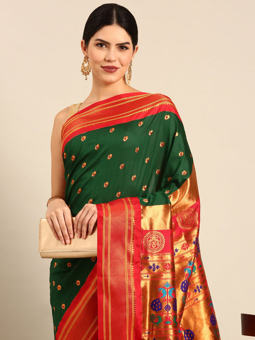 Maharani paithani saree soft silk in bottle green and red with small peacock meena butti - closeup view showing fabric and zari work for wedding wear