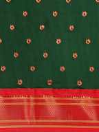 Maharani paithani saree silk blend in bottle green and red with small peacock meena butti - body fabric detail showing motif design for wedding wear