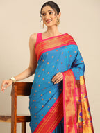 Maharani paithani saree silk blend in firozi and pink with small peacock meena butti - closeup view showing fabric and zari work for wedding wear