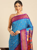 Maharani paithani saree silk blend in firozi and violet with small peacock meena butti - closeup view showing fabric and zari work for wedding wear