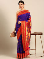 Maharani paithani saree silk blend in indigo blue and red with small peacock meena butti - front view for wedding wear