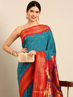 Maharani paithani saree silk blend in rama green and red with small peacock meena butti - closeup view showing fabric and zari work for wedding wear