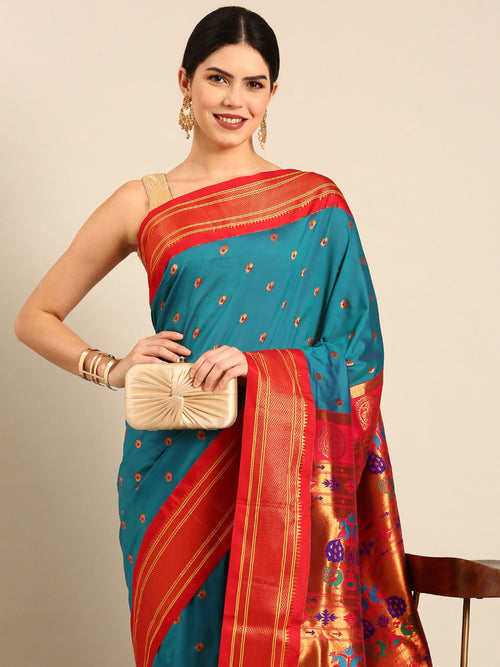 Maharani paithani saree soft silk in rama green and red with small peacock meena butti - closeup view showing fabric and zari work for wedding wear