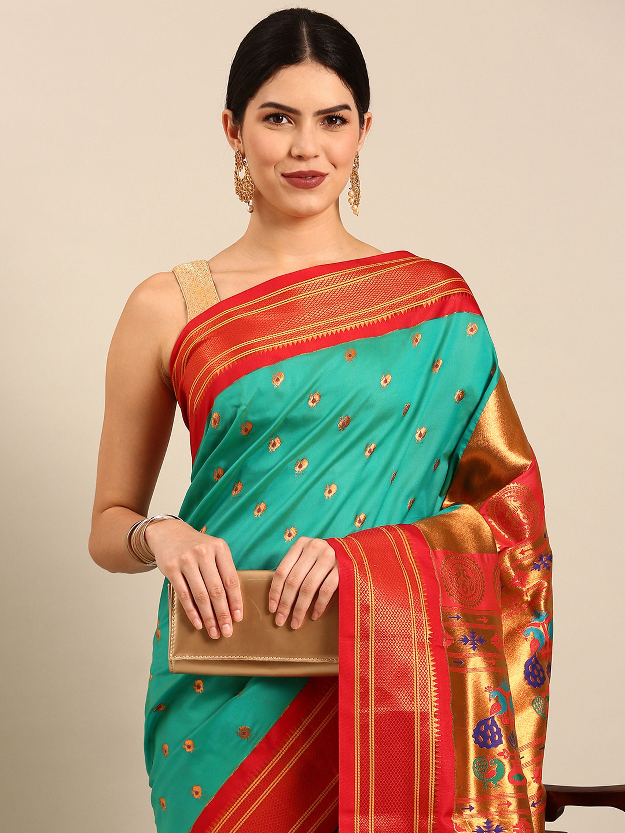 Maharani paithani saree silk blend in sea green and red with small peacock meena butti - closeup view showing fabric and zari work for wedding wear