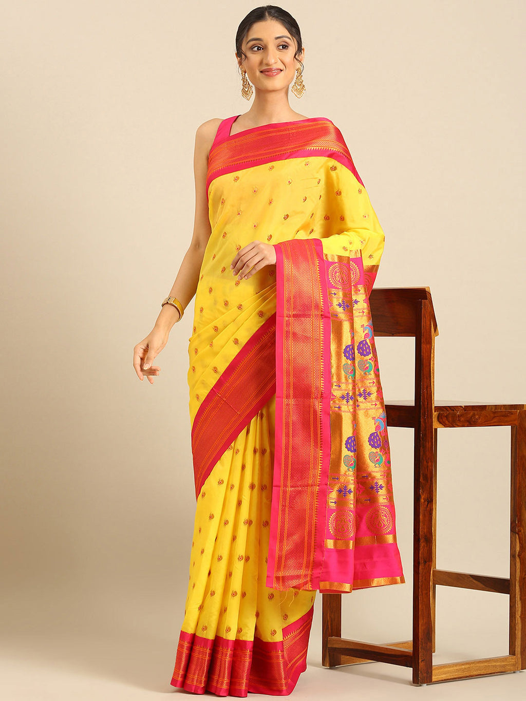 Maharani paithani saree silk blend in yellow and pink with small peacock meena butti - styled model view for wedding wear