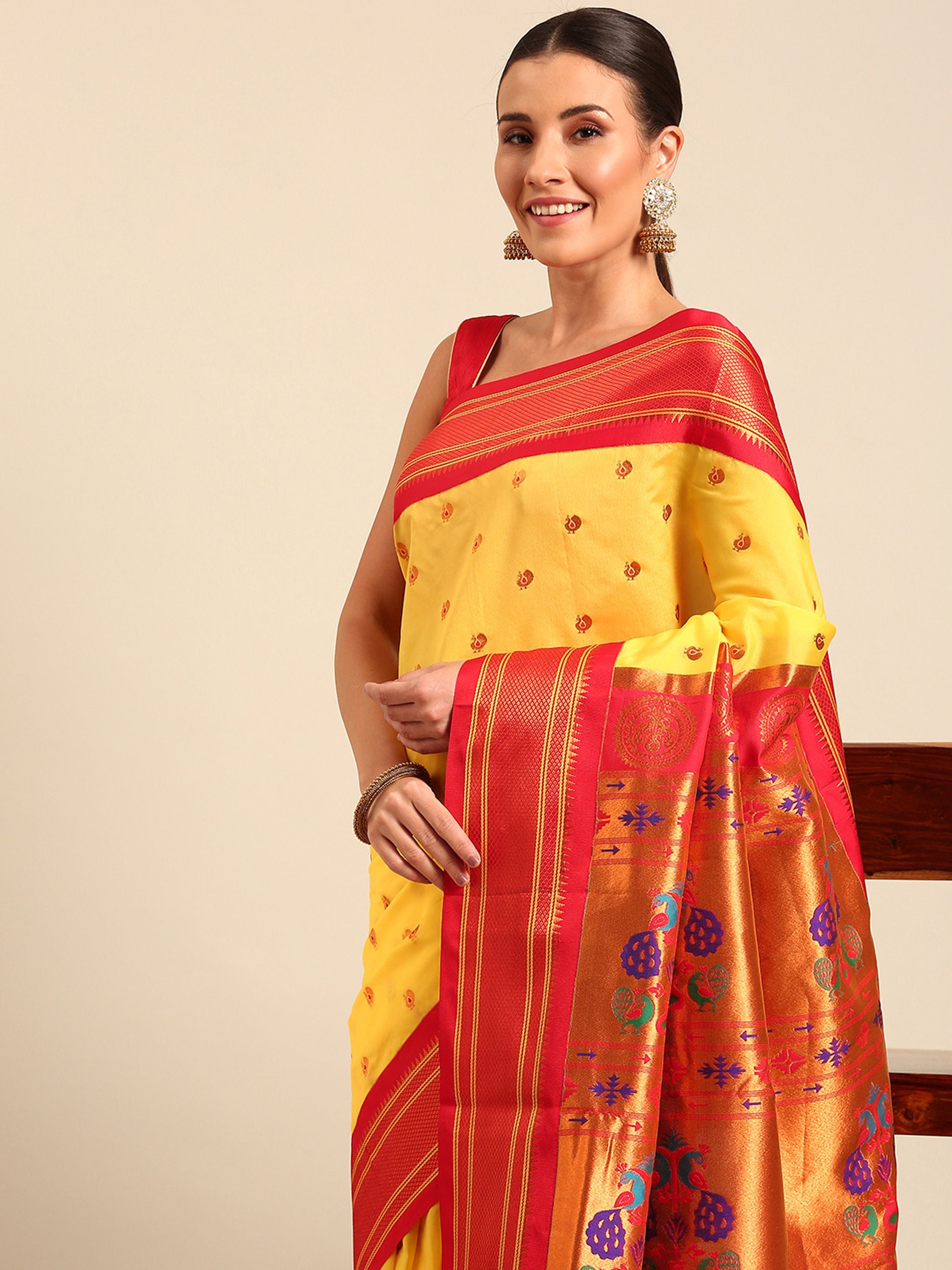 Maharani paithani saree silk blend in yellow and red with small peacock meena butti - closeup view showing fabric and zari work for wedding wear