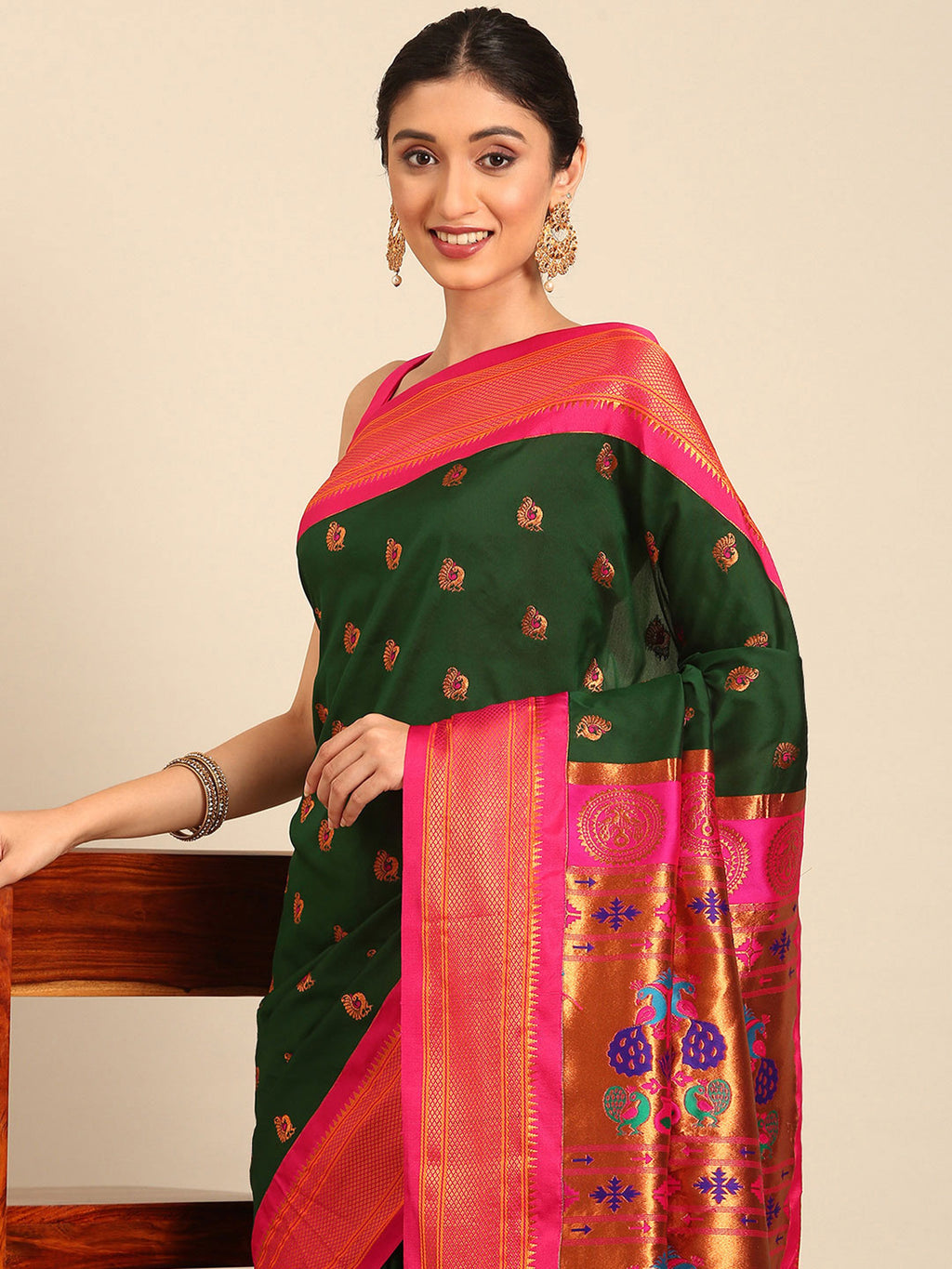 Maharani paithani saree silk blend in bottle green and pink with big peacock meena butti - closeup view showing fabric and zari work for party wear