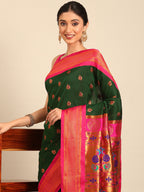 Maharani paithani saree silk blend in bottle green and pink with big peacock meena butti - closeup view showing fabric and zari work for party wear