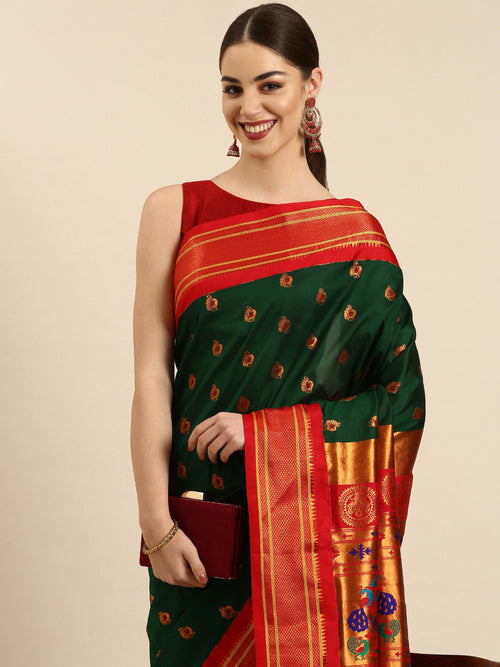 Maharani paithani saree soft silk in bottle green and red with big peacock meena butti - closeup view showing fabric and zari work for party wear