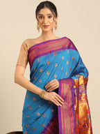 Maharani paithani saree silk blend in firozi and violet with big peacock meena butti - closeup view showing fabric and zari work for party wear