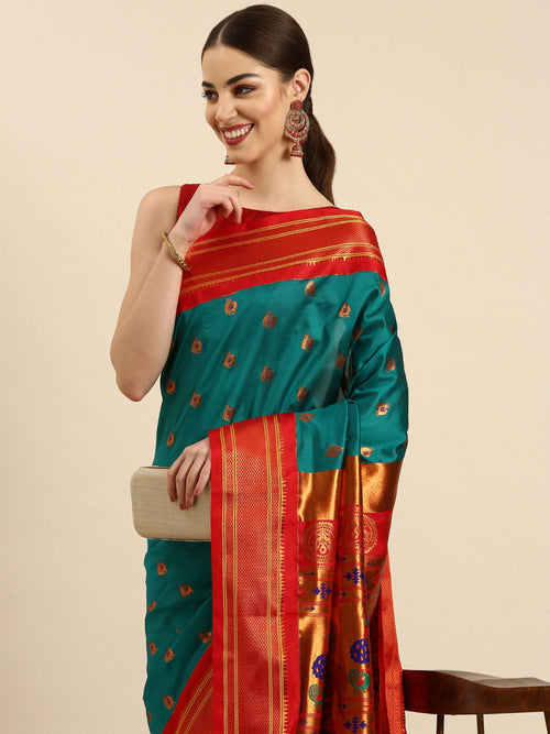 Maharani paithani saree soft silk in rama green and red with big peacock meena butti - closeup view showing fabric and zari work for party wear