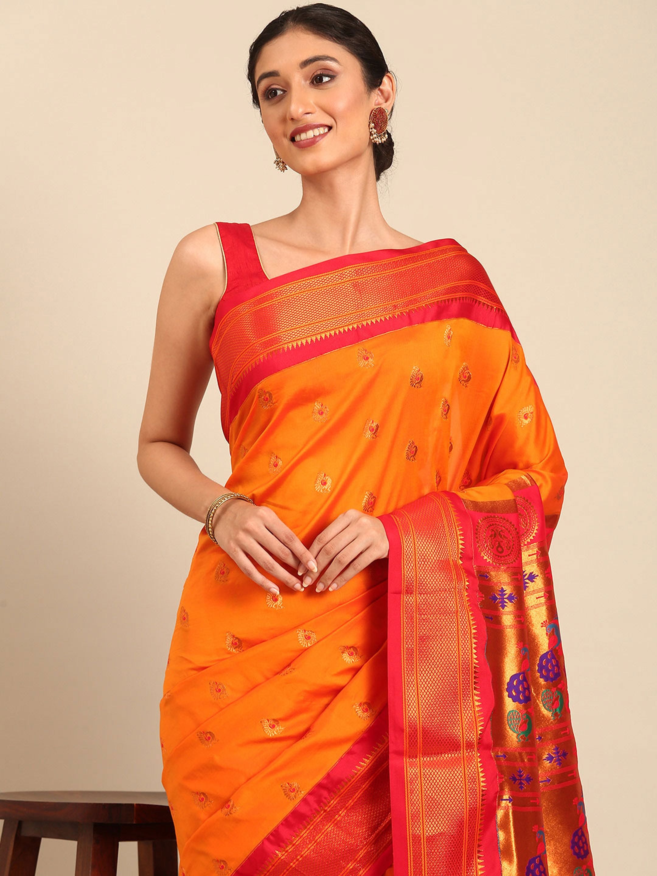 Maharani paithani saree silk blend in saffron and red with big peacock meena butti - closeup view showing fabric and zari work for party wear