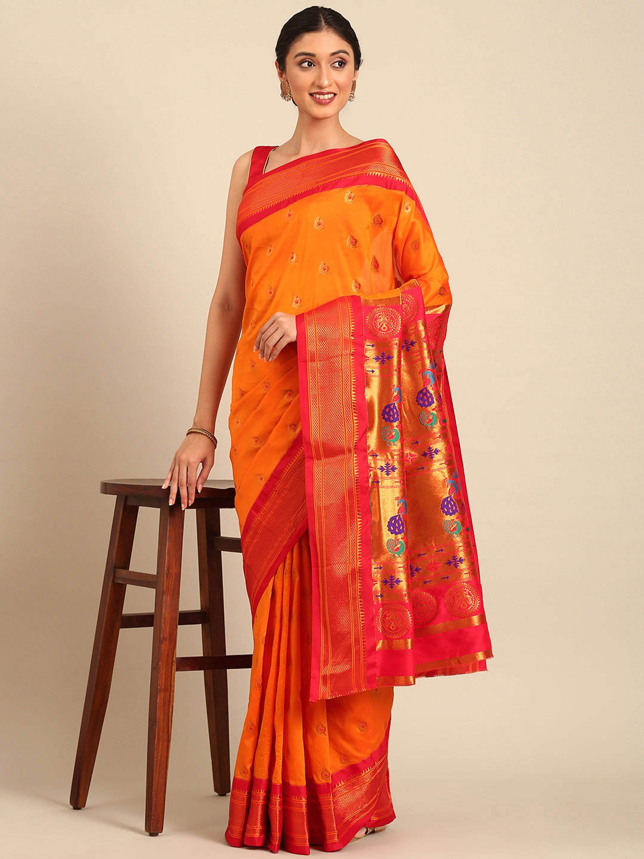 Maharani paithani saree silk blend in saffron and red with big peacock meena butti - styled model view for party wear