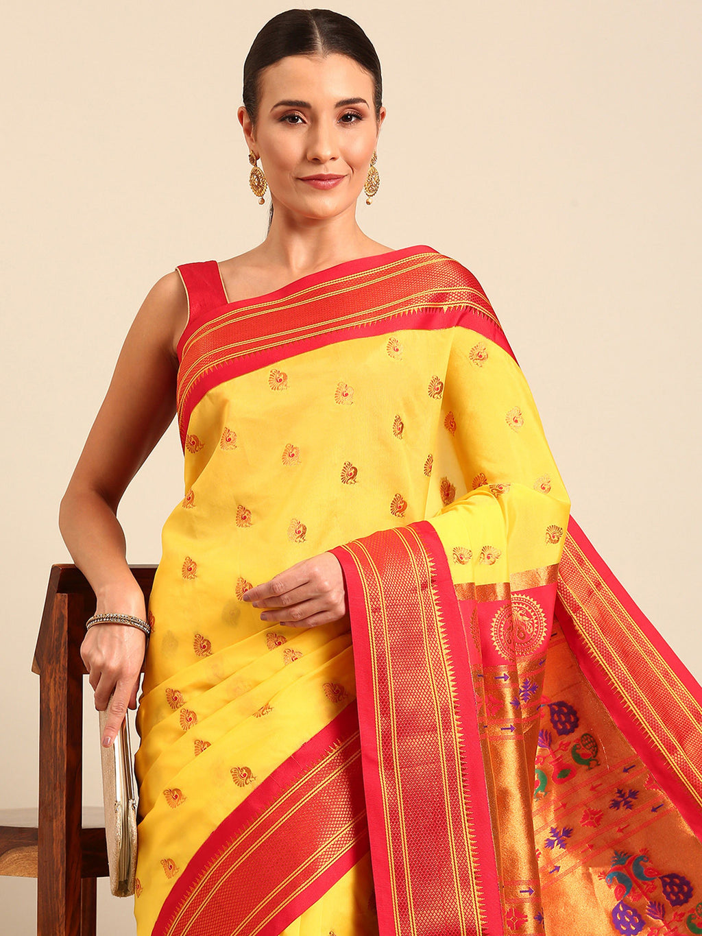Maharani paithani saree silk blend in yellow and red with big peacock meena butti - closeup view showing fabric and zari work for party wear